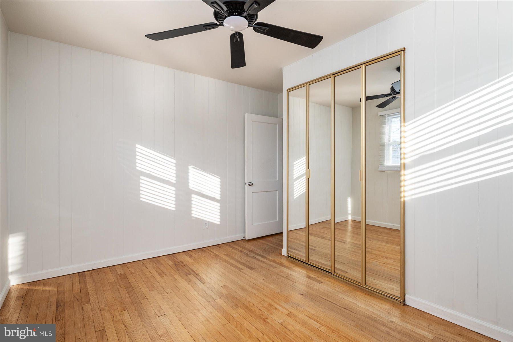 45 Clipper Road Essex, MD 21221 - Photo 20 of 36 wooden floor in an empty room with a window