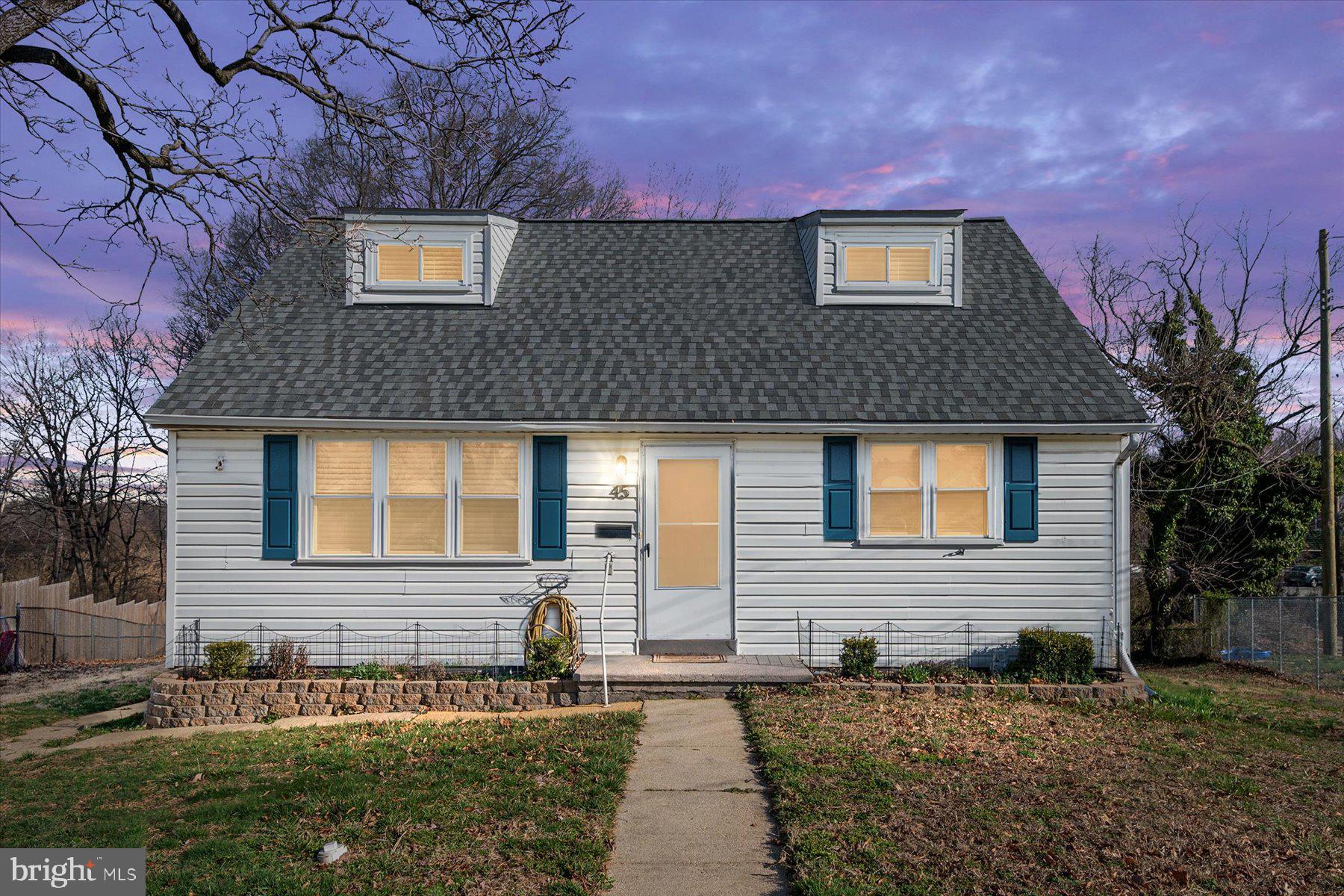 45 Clipper Road Essex, MD 21221 - Photo 2 of 36 a front view of a house with a yard