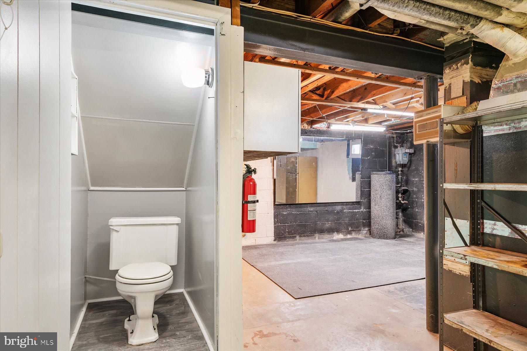 45 Clipper Road Essex, MD 21221 - Photo 28 of 36 a bathroom with a toilet and a shower