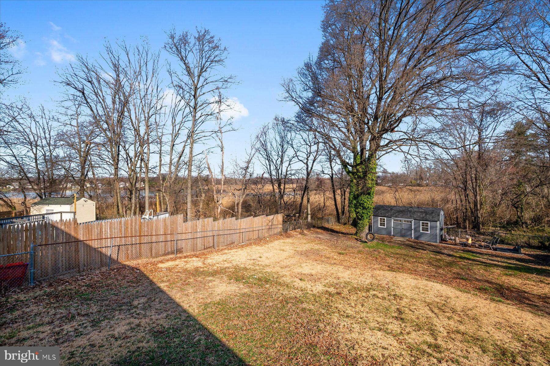 45 Clipper Road Essex, MD 21221 - Photo 36 of 36 a view of a yard with a bench and trees