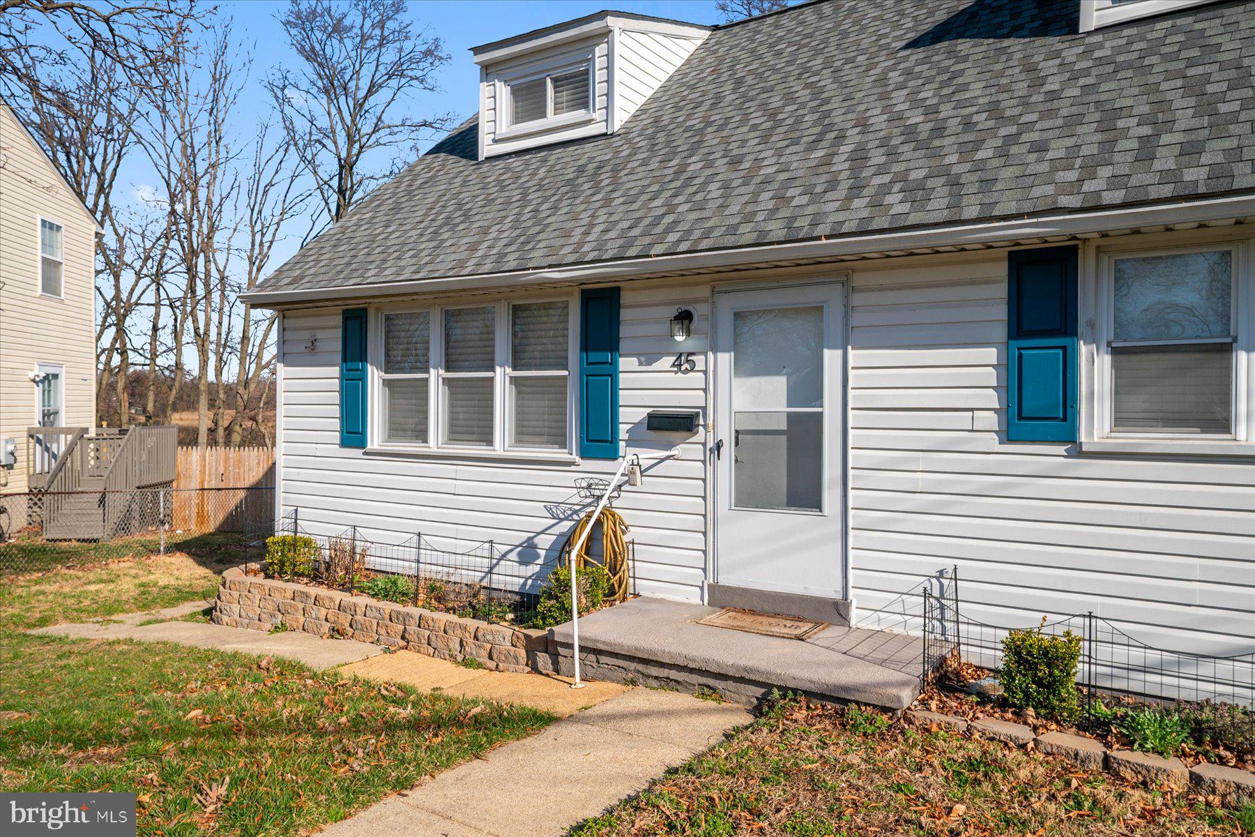 45 Clipper Road Essex, MD 21221 - Photo 5 of 36 a front view of a house with a garden