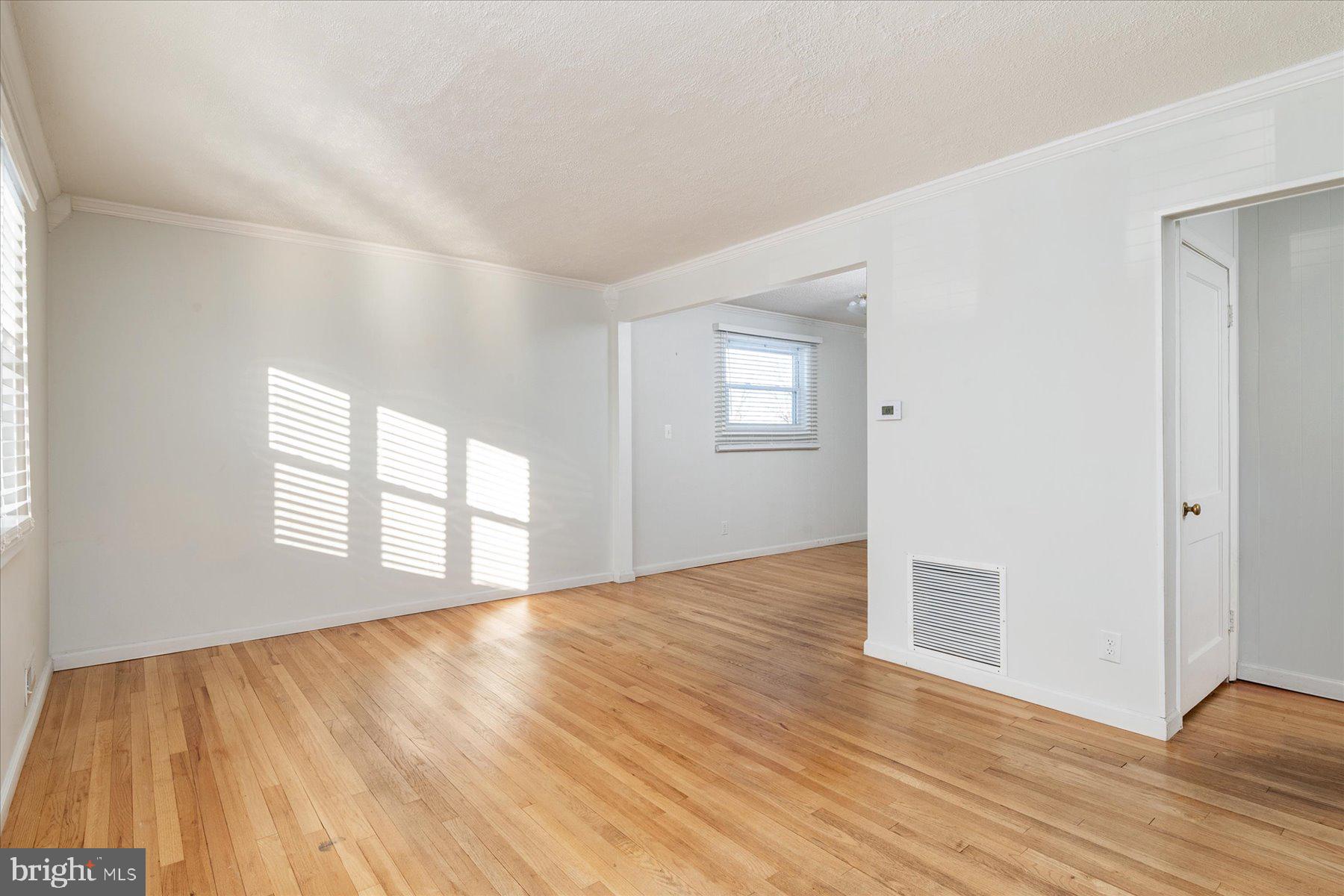 45 Clipper Road Essex, MD 21221 - Photo 7 of 36 a view of an empty room and window