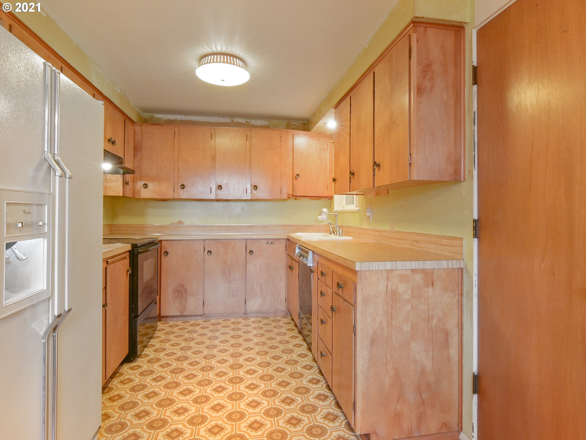 1509 6th Street Springfield, OR 97477 - Photo 11 of 30 a kitchen with stainless steel appliances granite countertop a sink and cabinets
