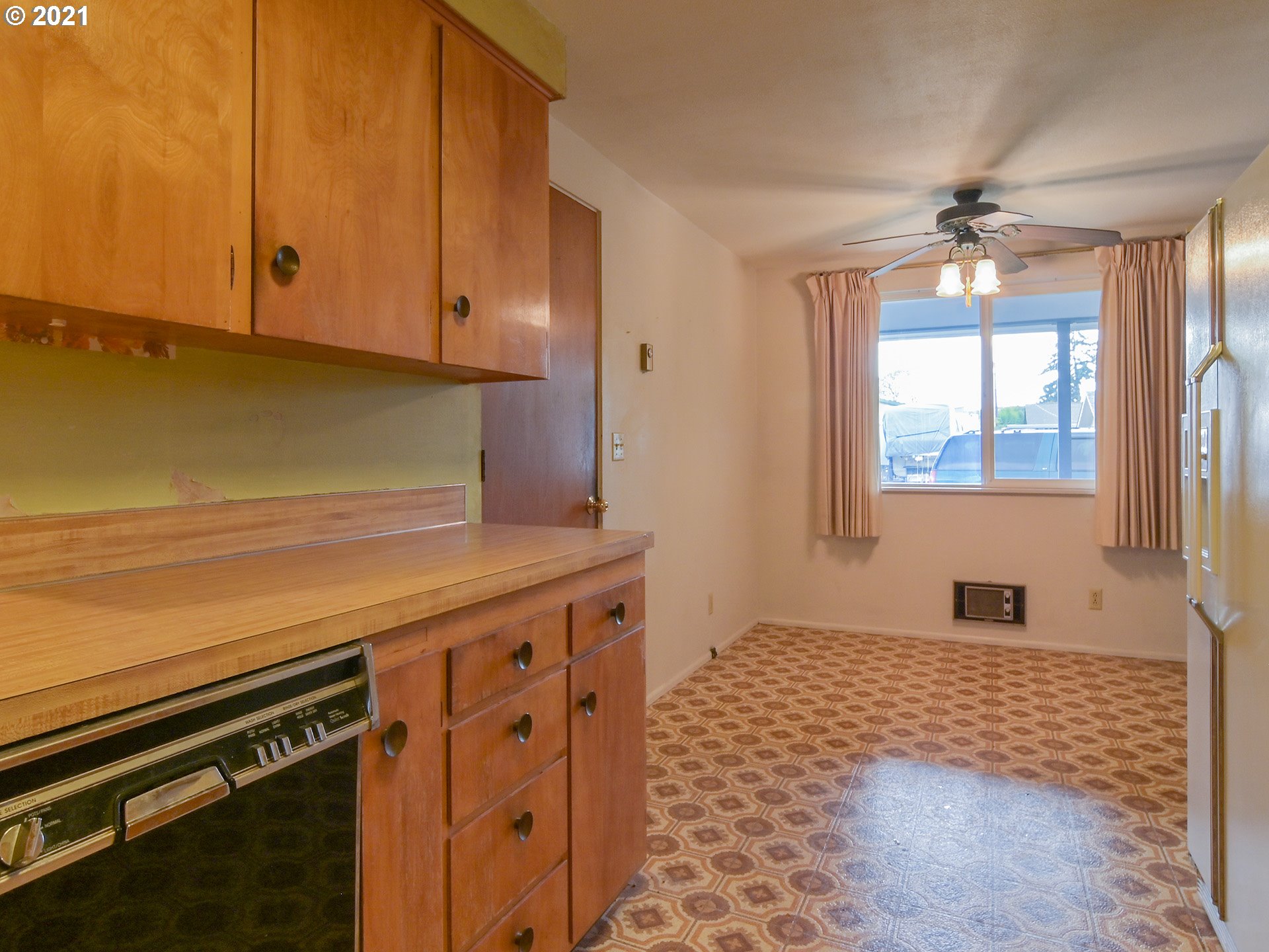 1509 6th Street Springfield, OR 97477 - Photo 12 of 30 a kitchen with stainless steel appliances a stove and a window