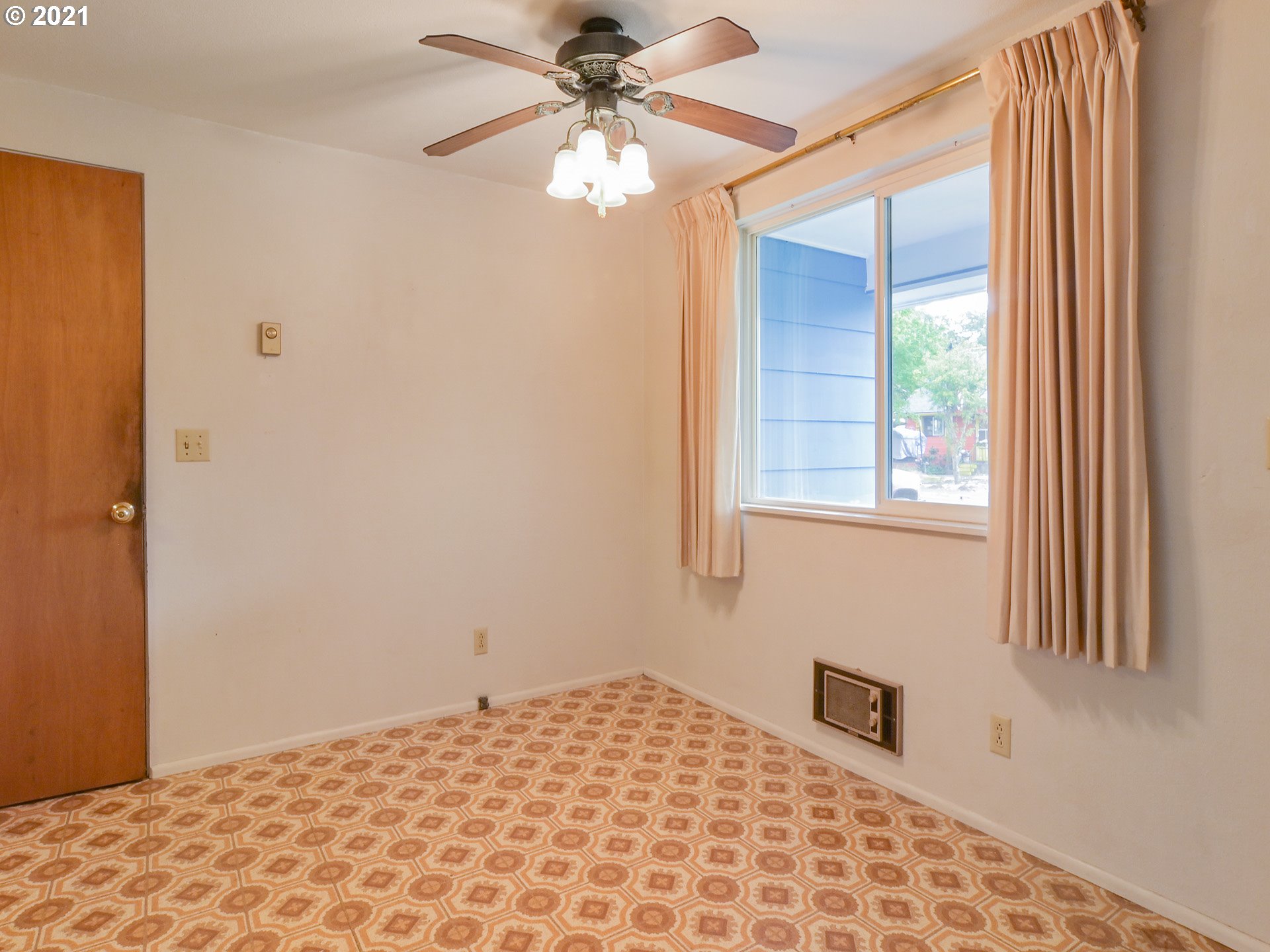 1509 6th Street Springfield, OR 97477 - Photo 13 of 30 a bedroom with a bed and a window
