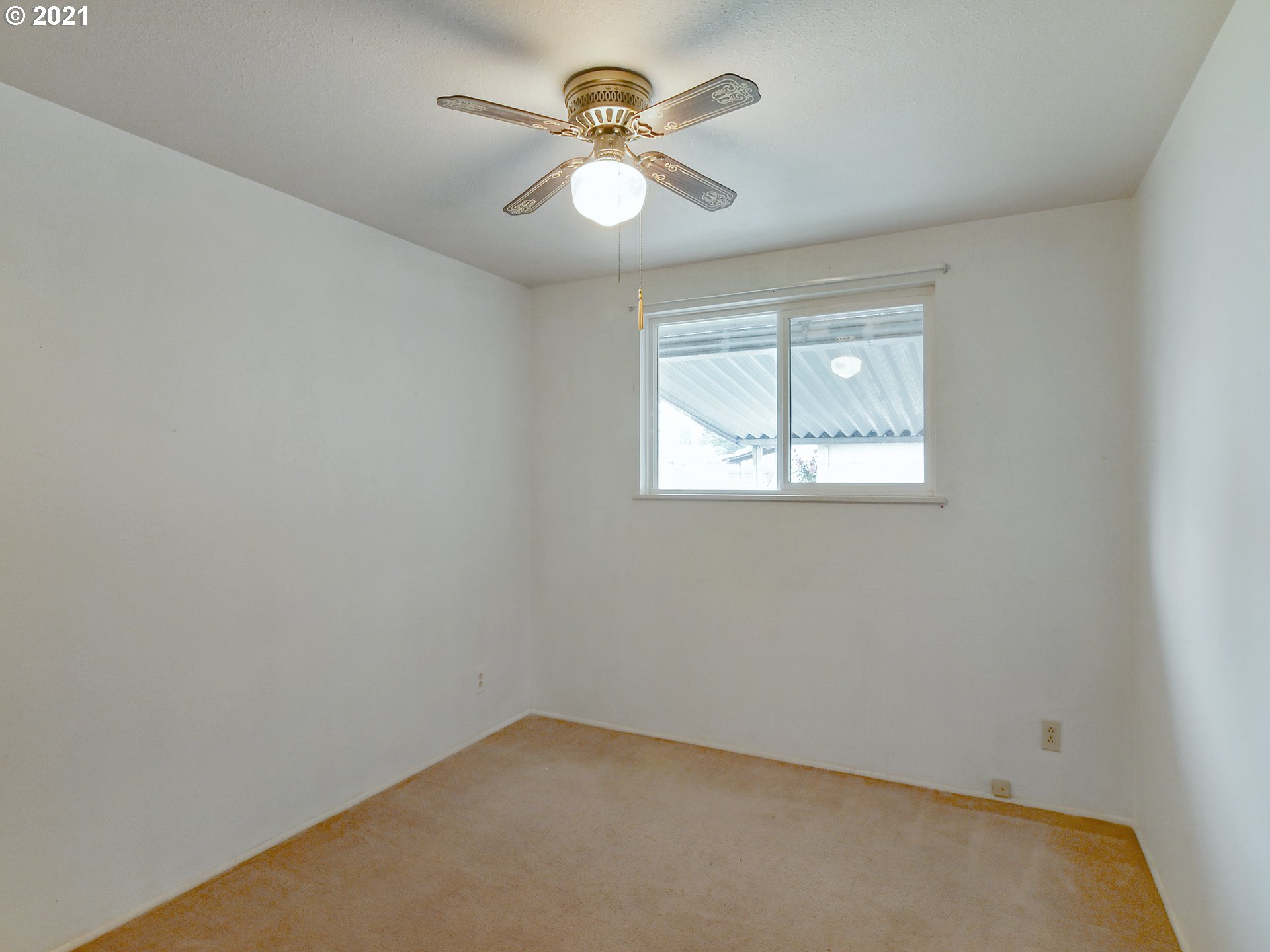 1509 6th Street Springfield, OR 97477 - Photo 20 of 30 an empty room with windows and a fan