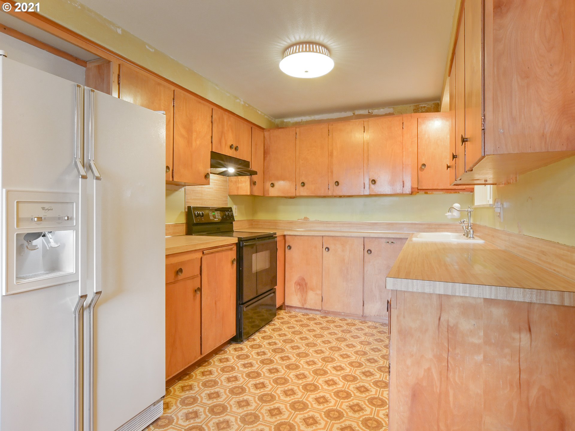 1509 6th Street Springfield, OR 97477 - Photo 10 of 30 a kitchen with stainless steel appliances granite countertop a sink and cabinets