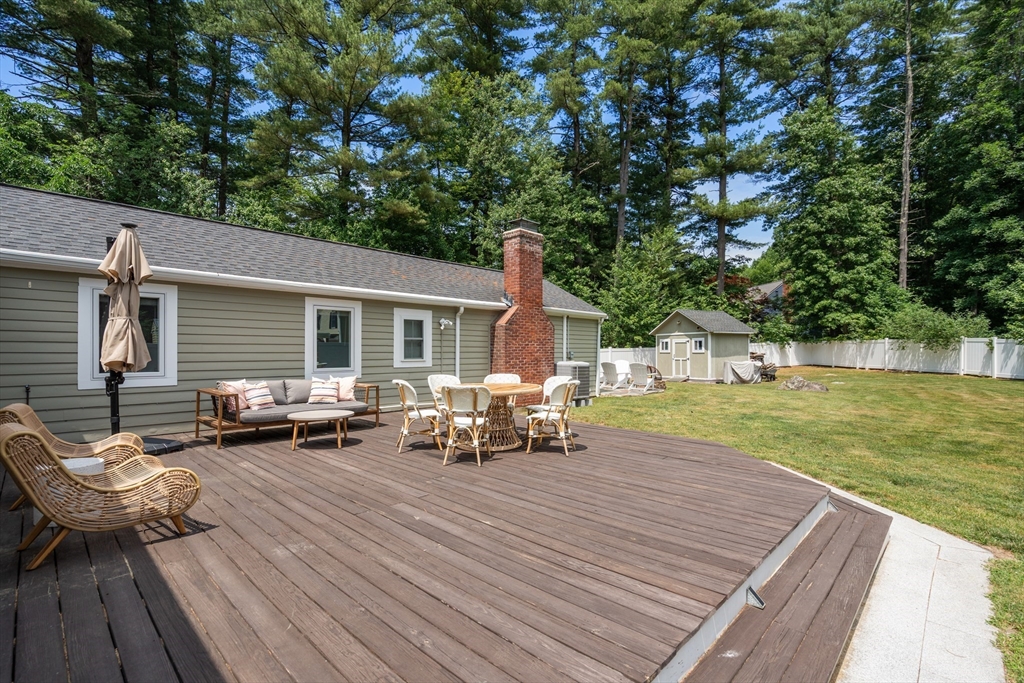 57 Marlboro Road Sudbury, MA 01776 - Photo 30 of 40 a view of a house with backyard sitting area and garden