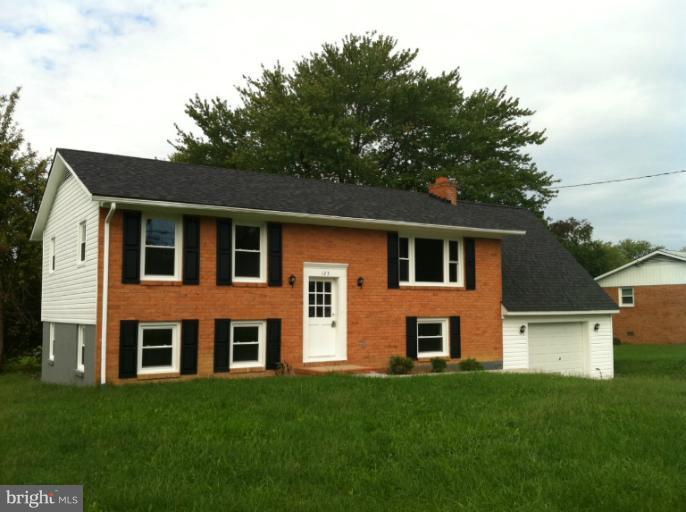 123 Little Whim Road Fredericksburg, VA 22405 - Photo 1 of 17 a front view of a house with a yard