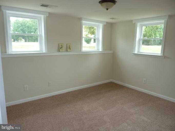 123 Little Whim Road Fredericksburg, VA 22405 - Photo 11 of 17 an empty room with a window