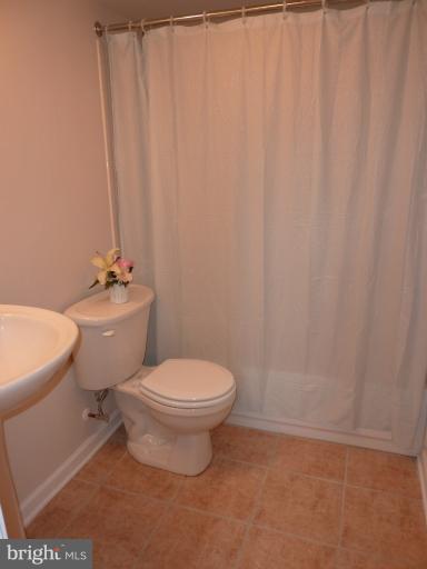 123 Little Whim Road Fredericksburg, VA 22405 - Photo 12 of 17 a white toilet sitting next to a white sink