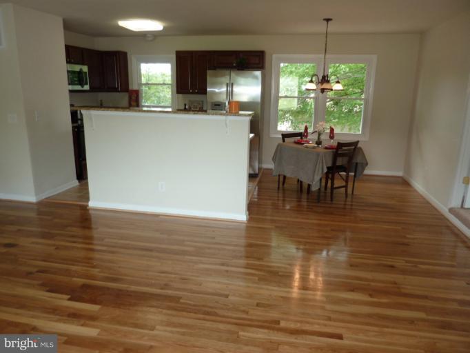 123 Little Whim Road Fredericksburg, VA 22405 - Photo 17 of 17 a view of a dining room with furniture and chandelier
