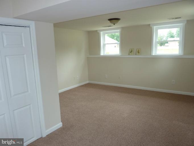 123 Little Whim Road Fredericksburg, VA 22405 - Photo 7 of 17 an empty room with a window
