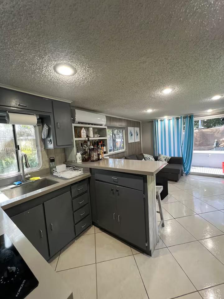 100 Morris Lane, Unit B2 Key Largo, FL 33037 - Photo 15 of 49 a kitchen with granite countertop a sink and cabinets
