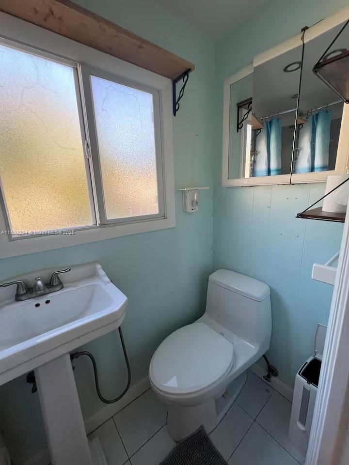 100 Morris Lane, Unit B2 Key Largo, FL 33037 - Photo 24 of 49 a white toilet sitting next to a bathroom sink