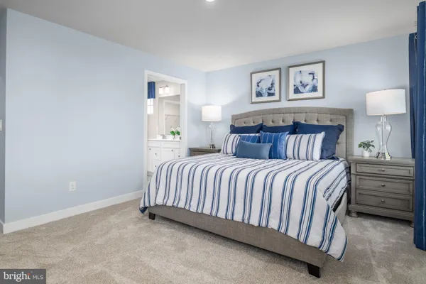 a bedroom with a bed and wall painting