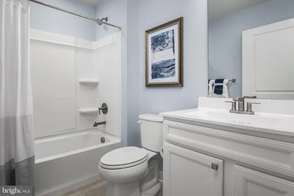 a bathroom with a sink a toilet and a bathtub