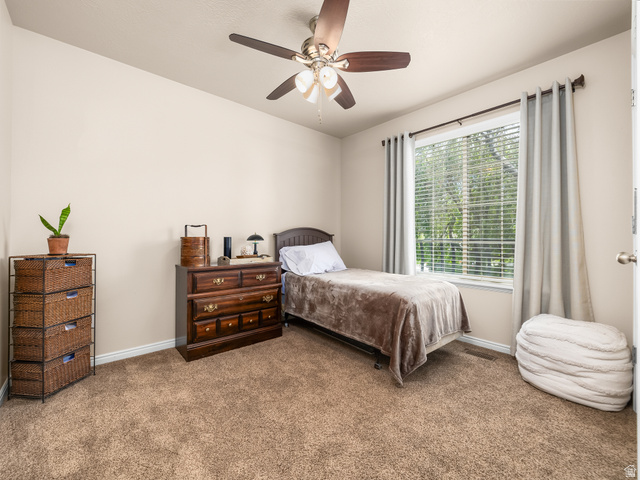 1602 Renaissance Way Springville, UT 84663 - Photo 19 of 42 Carpeted room featuring a window with blinds and drapes, a ceiling fan with integrated lighting, and neutral wall tones