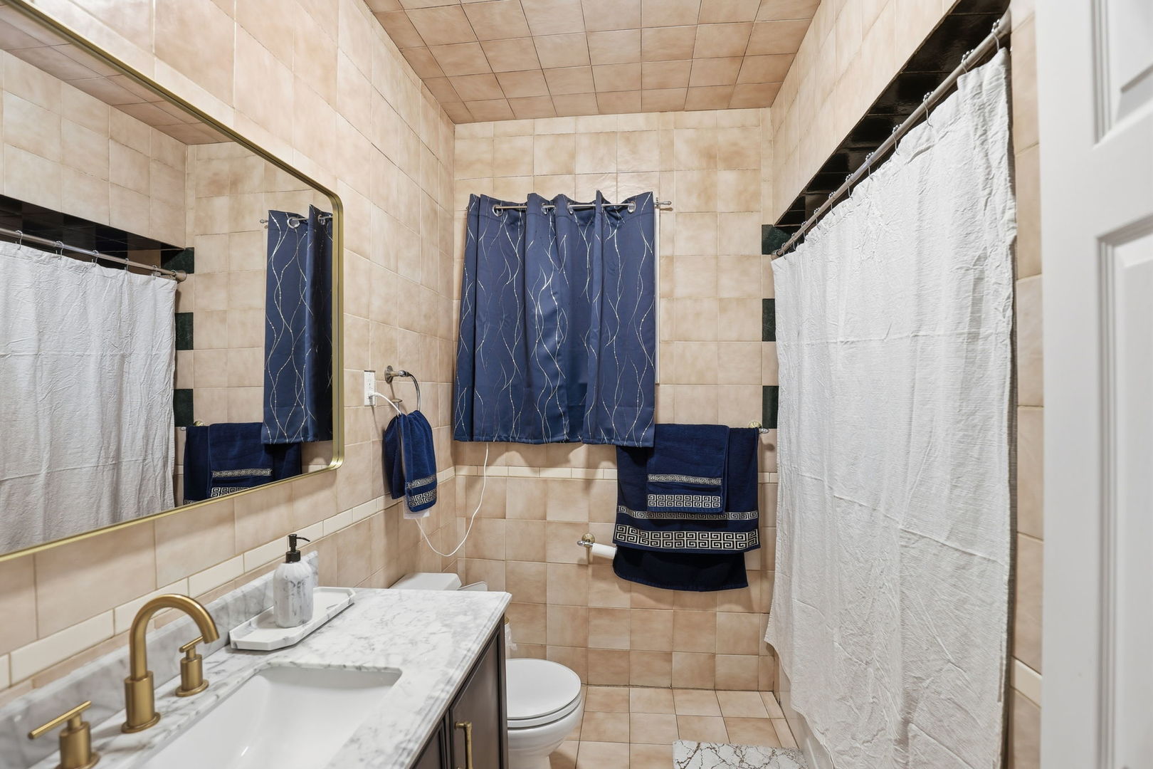 2407 Highland Avenue Berwyn, IL 60402 - Photo 13 of 25 a bathroom with a sink and a mirror