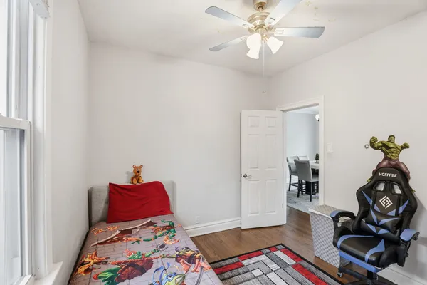 a bedroom with furniture and a chandelier