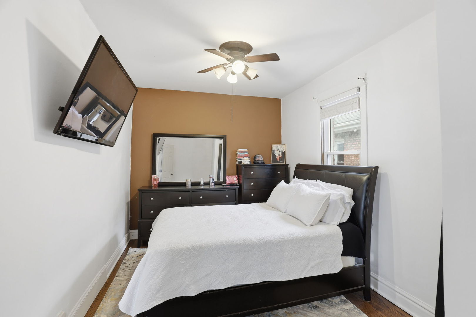 2407 Highland Avenue Berwyn, IL 60402 - Photo 15 of 25 a bedroom with a bed and a painting on the wall