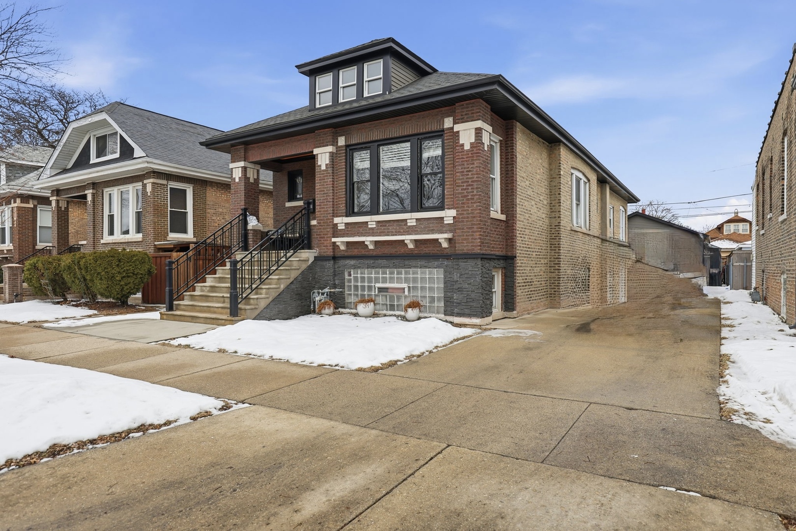 2407 Highland Avenue Berwyn, IL 60402 - Photo 2 of 25 a front view of a house with a yard and garage