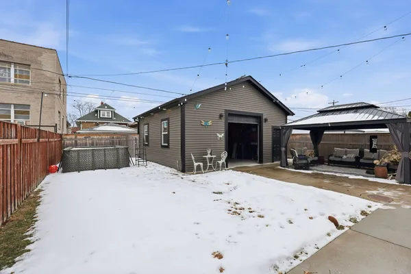 a view of a house with a snow in front of it