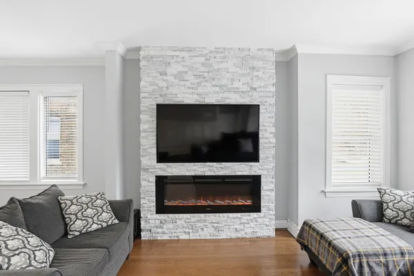 a living room with furniture and a fireplace