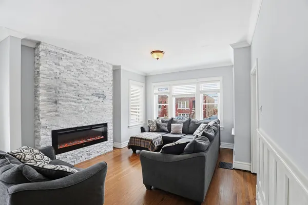 a living room with furniture and a fireplace
