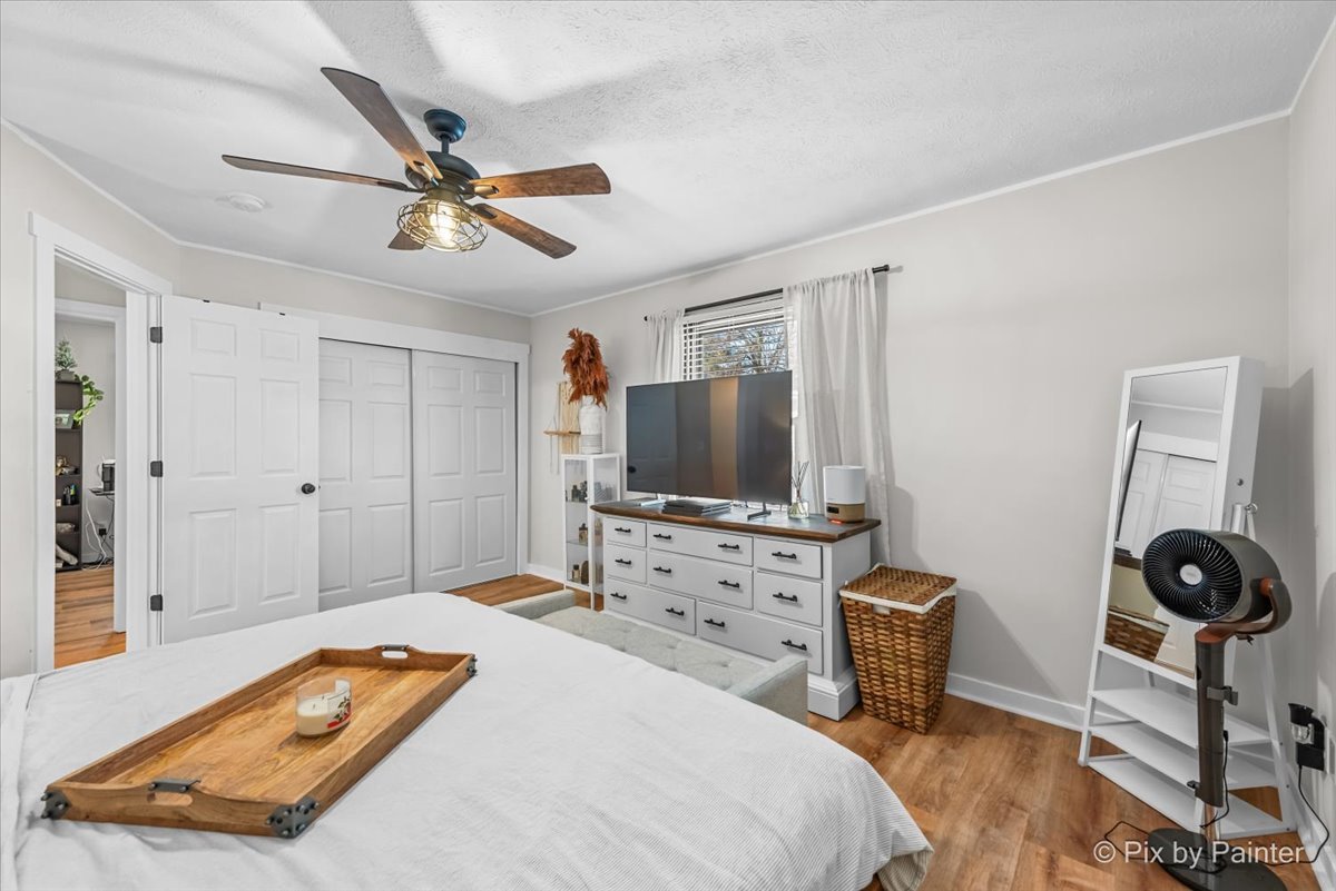 117 Benedict Drive Southwest Poplar Grove, IL 61065 - Photo 12 of 27 a bedroom with a bed and a flat screen tv