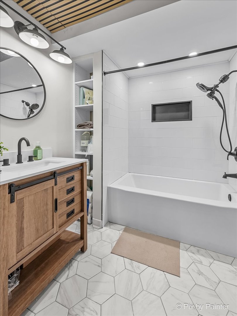 117 Benedict Drive Southwest Poplar Grove, IL 61065 - Photo 17 of 27 a bathroom with a sink a vanity and a mirror