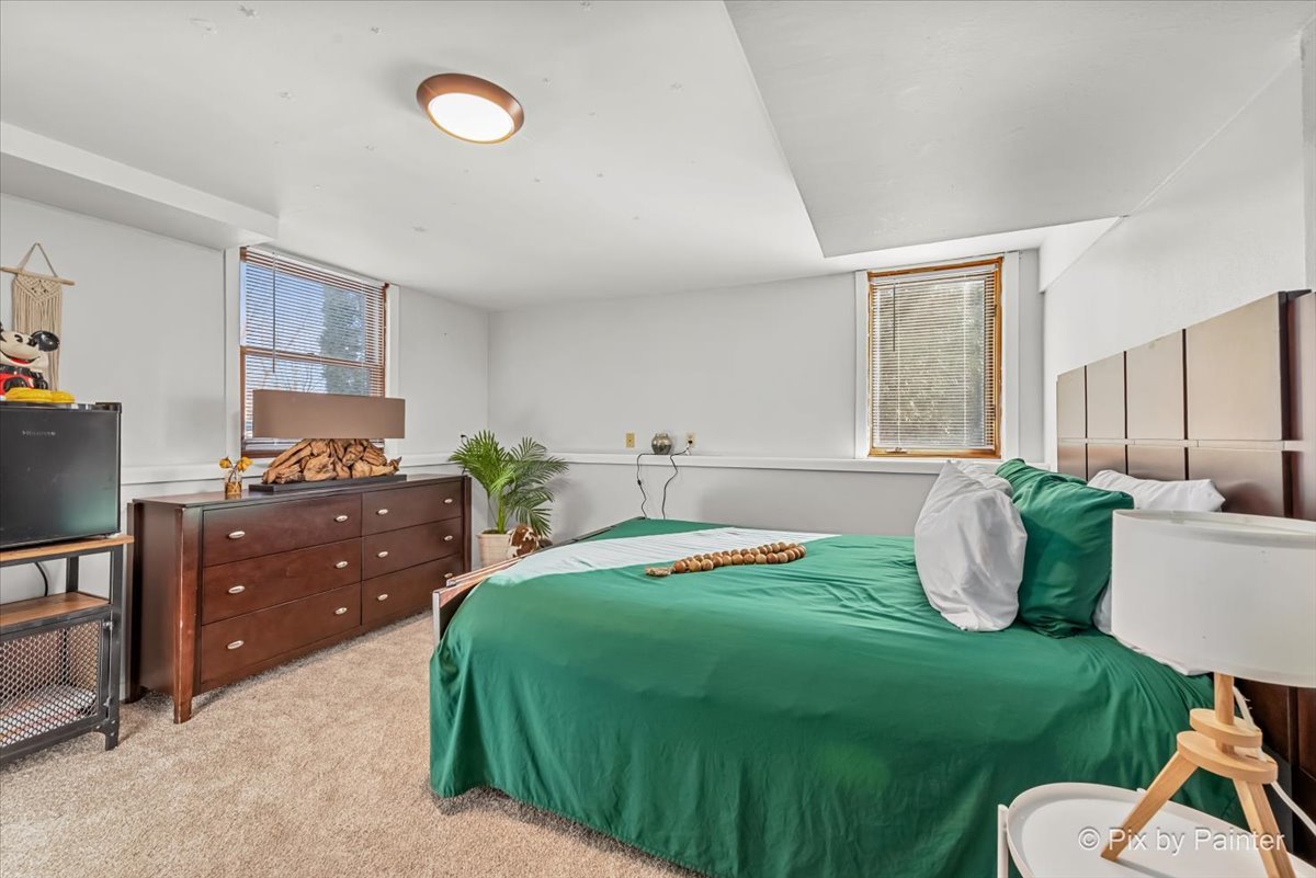 117 Benedict Drive Southwest Poplar Grove, IL 61065 - Photo 18 of 27 a bedroom with a bed and window