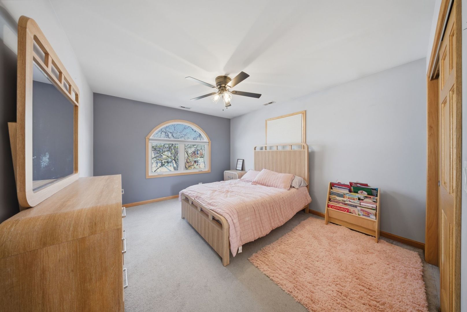5325 North Meade Avenue Chicago, IL 60630 - Photo 12 of 24 a bedroom with a bed and a chandelier