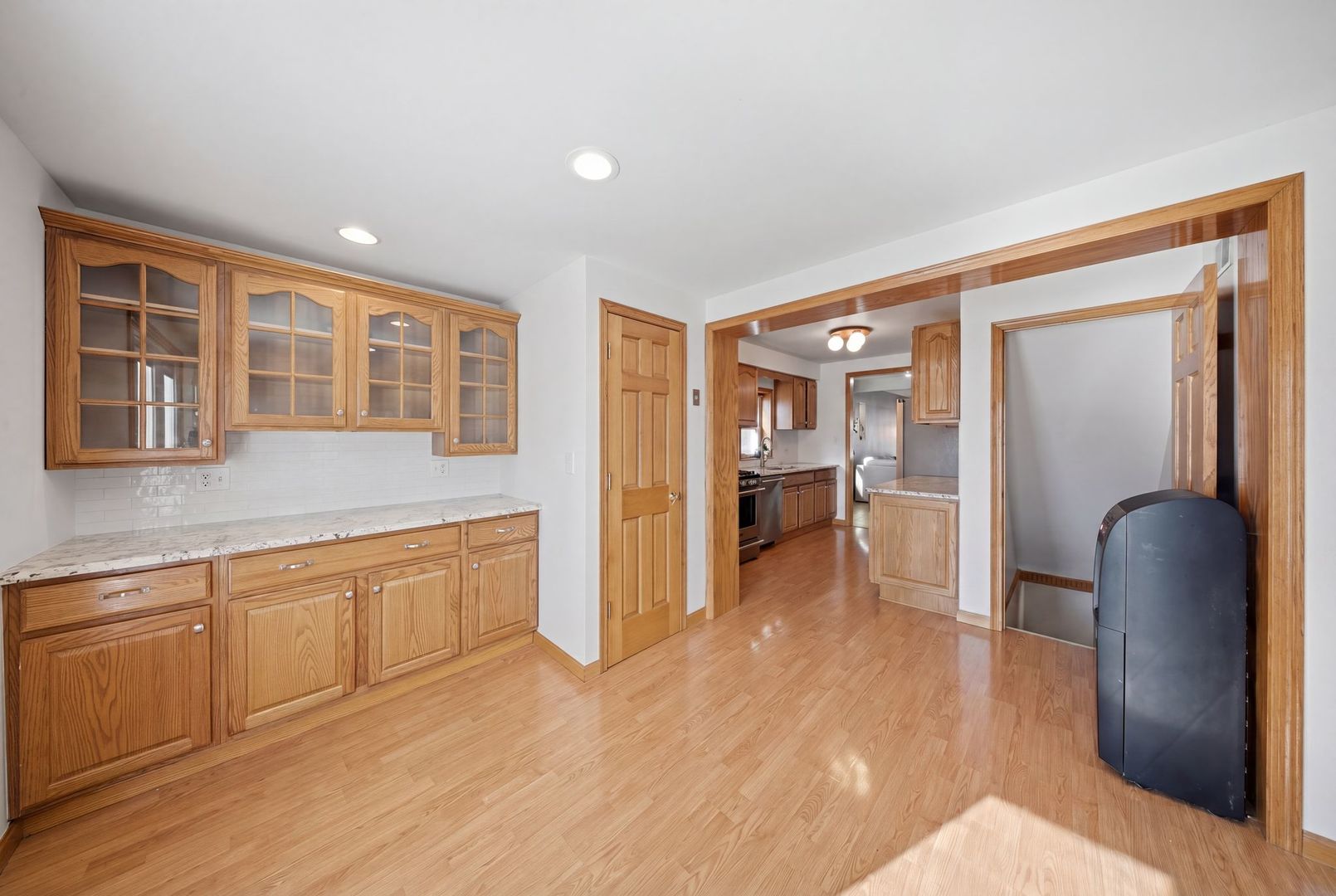 5325 North Meade Avenue Chicago, IL 60630 - Photo 5 of 24 a large kitchen with stainless steel appliances granite countertop a refrigerator and a sink
