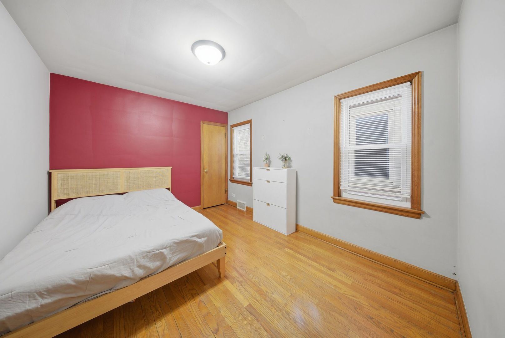 5325 North Meade Avenue Chicago, IL 60630 - Photo 6 of 24 a bedroom with a bed and a window