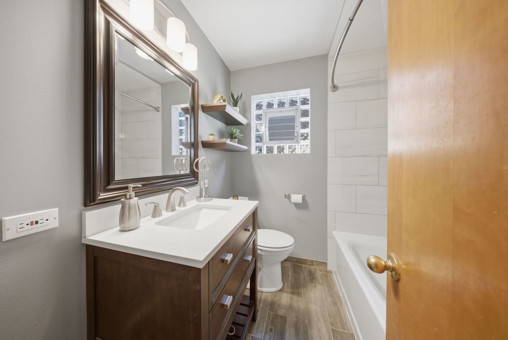 5325 North Meade Avenue Chicago, IL 60630 - Photo 7 of 24 a bathroom with a sink and a mirror