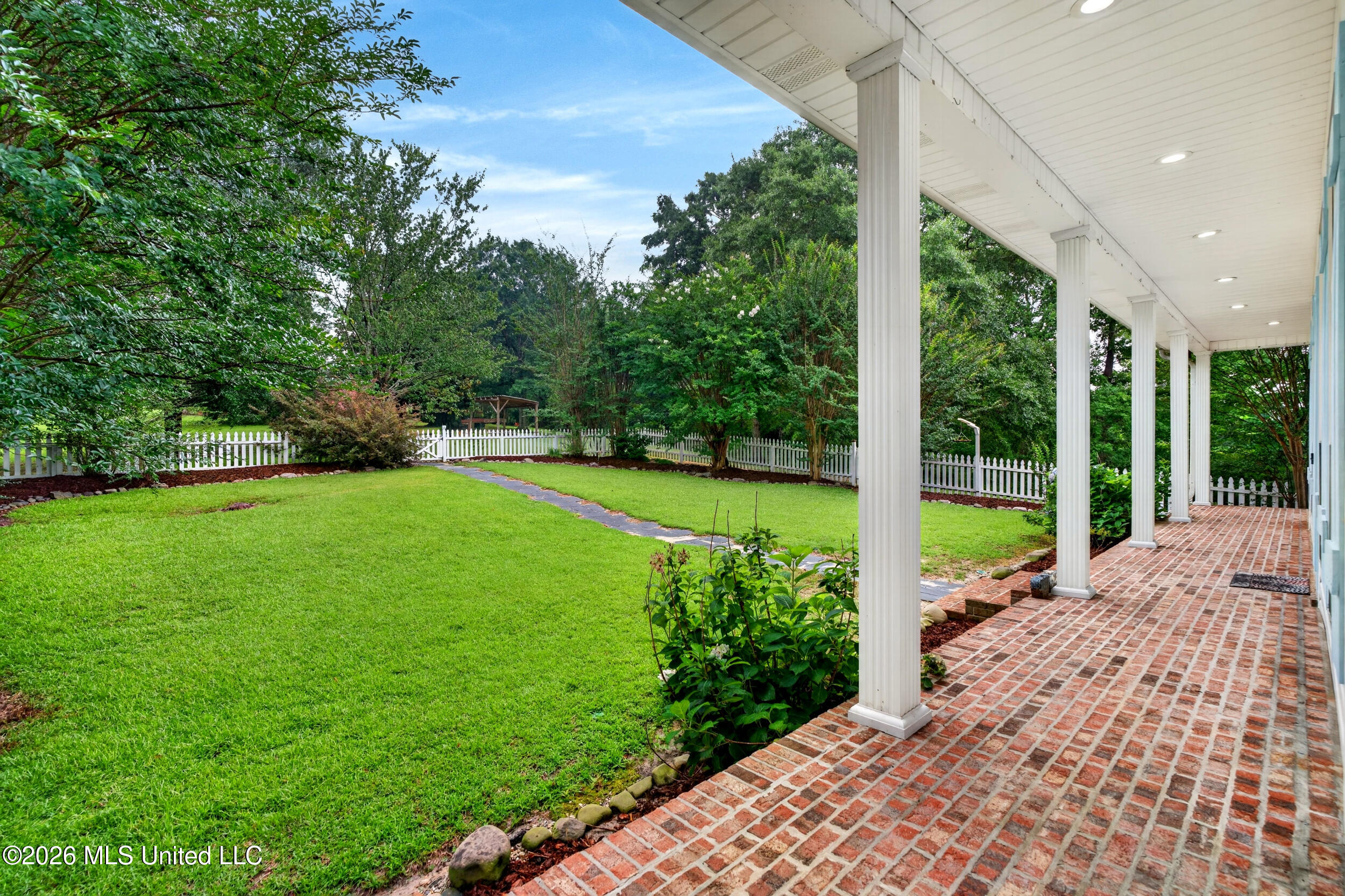 219 Pop Hill Road, Unit B Poplarville, MS 39470 - Photo 11 of 74 11_11_frontyard_porch
