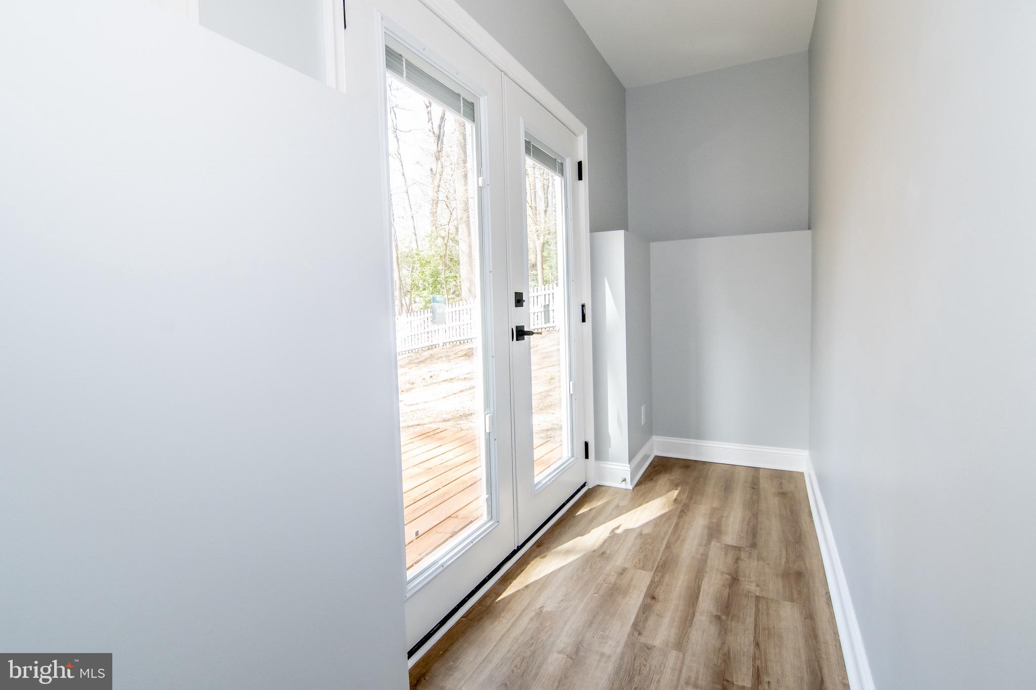 622 Silver Rock Road Lusby, MD 20657 - Photo 32 of 42 Exit to backyard walkout from lower level.