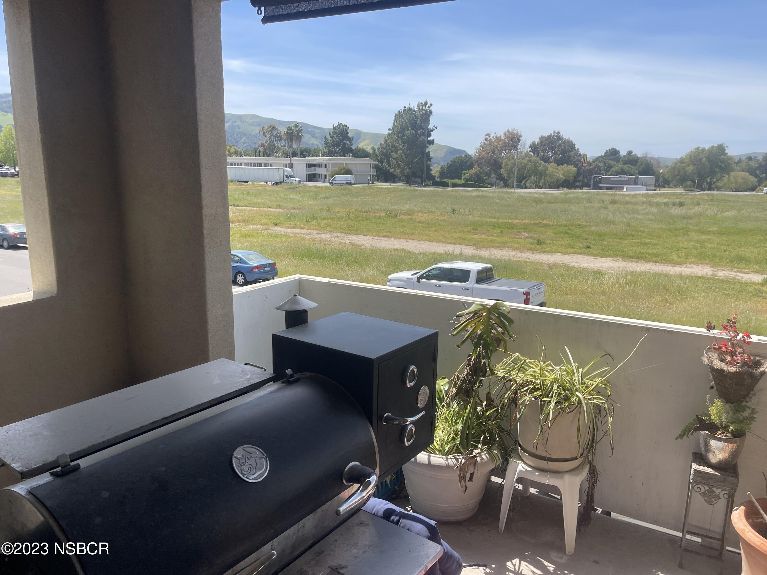 232 Robles Way Buellton, CA 93427 - Photo 6 of 6 a view of a balcony with lake view and a potted plant