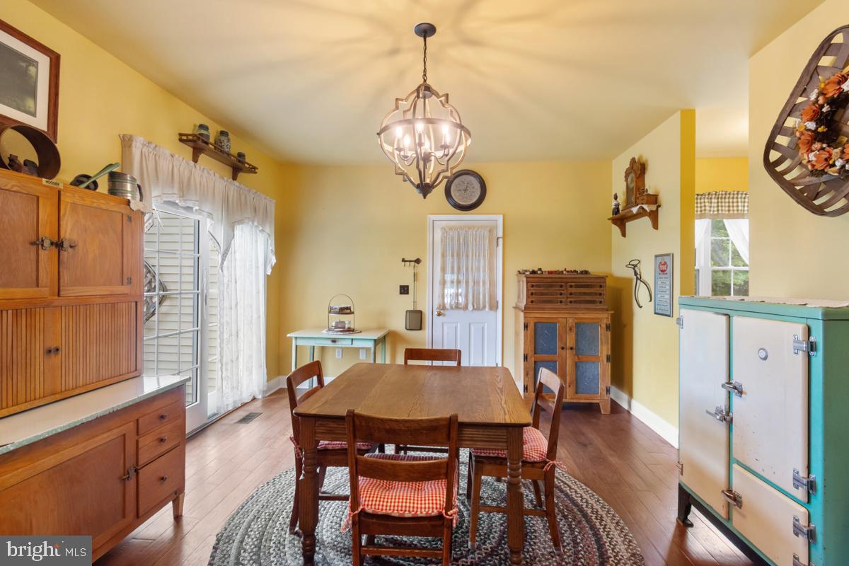 31 Quail Court Littlestown, PA 17340 - Photo 11 of 26 a view of a dining room with furniture window and wooden floor