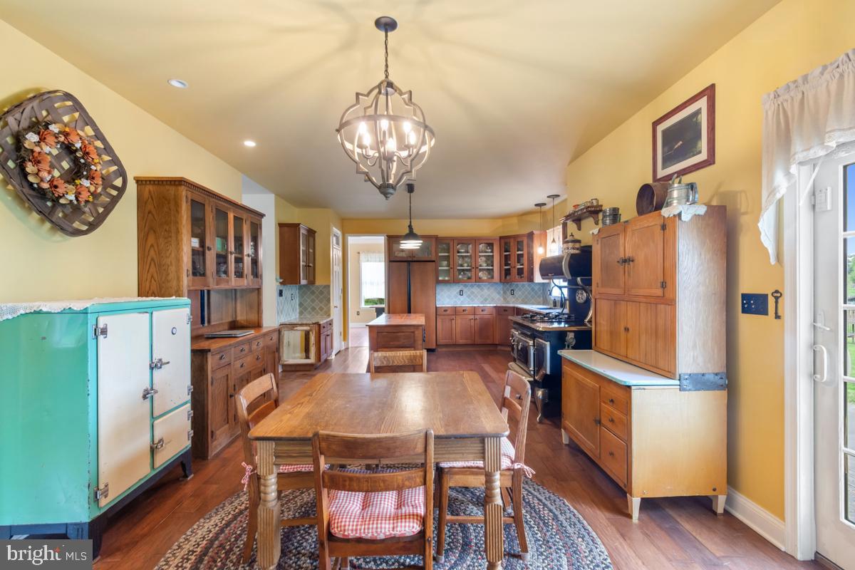 31 Quail Court Littlestown, PA 17340 - Photo 12 of 26 a view of a dining room with furniture a chandelier and wooden floor