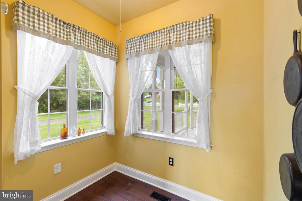31 Quail Court Littlestown, PA 17340 - Photo 13 of 26 a view of a room with a large window and wooden floor