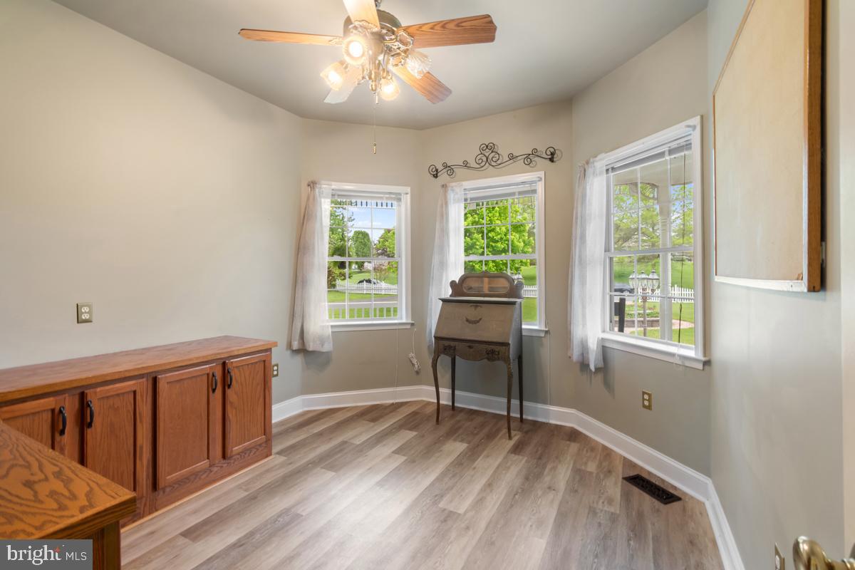 31 Quail Court Littlestown, PA 17340 - Photo 14 of 26 a view of an empty room with a window and wooden floor