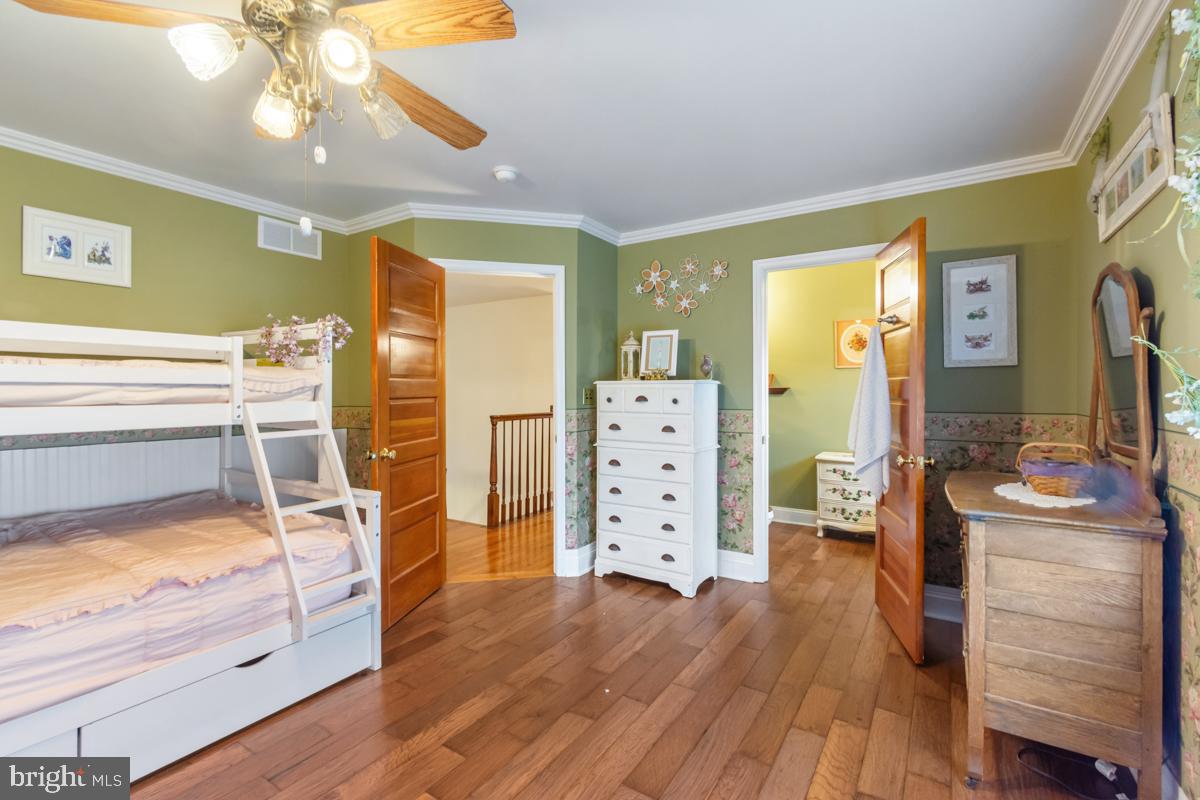 31 Quail Court Littlestown, PA 17340 - Photo 16 of 26 a bedroom with a bed and wooden floor