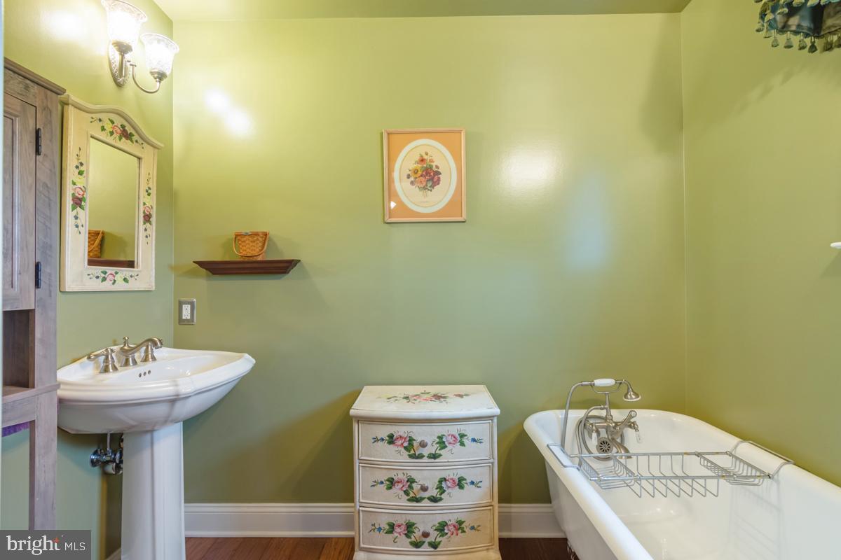 31 Quail Court Littlestown, PA 17340 - Photo 17 of 26 a bathroom with a sink a mirror and a toilet