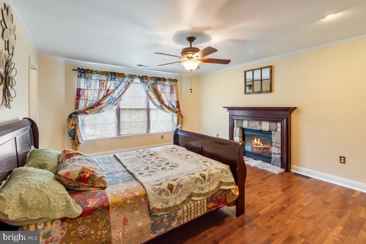 31 Quail Court Littlestown, PA 17340 - Photo 20 of 26 a bedroom with a bed and a chandelier