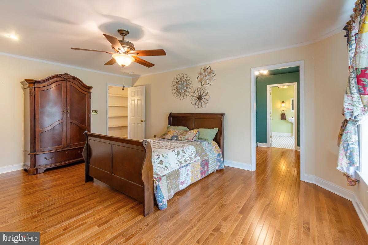 31 Quail Court Littlestown, PA 17340 - Photo 21 of 26 a bedroom with a bed and wooden floor