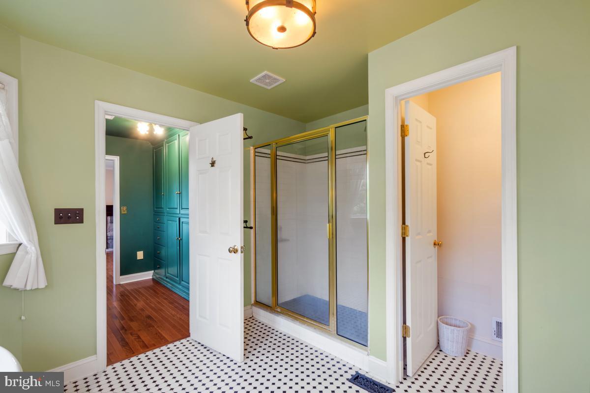 31 Quail Court Littlestown, PA 17340 - Photo 23 of 26 a bathroom with a glass door shower and a sink