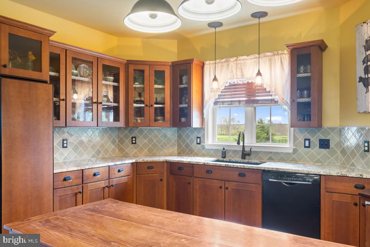 31 Quail Court Littlestown, PA 17340 - Photo 9 of 26 a kitchen with stainless steel appliances granite countertop a sink and cabinets