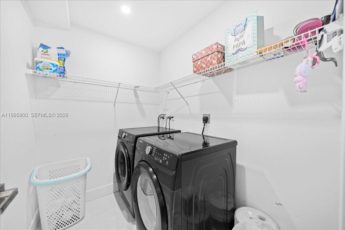 15341 Southwest 36th Street Miami, FL 33185 - Photo 13 of 56 a utility room with dryer and washer